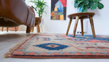 Vintage Turkish rug in living room setting, old rug, antique rug, pastel colors, faded colors, Turkish rug, vintage rug, soft rug, Portland, Oregon, rug store, rug shop, local shop