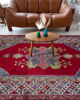 Vintage Turkish rug in a living room setting, pile rug, Turkish rug, vintage rug, portland, rug shop, bright colors, wild shaman, soft rug, bold color, Portland, Oregon, rug store, rug shop, local shop, antique rug