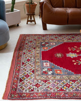 Vintage Turkish rug in a living room setting, pile rug, Turkish rug, vintage rug, portland, rug shop, bright colors, wild shaman, soft rug, bold color, Portland, Oregon, rug store, rug shop, local shop, antique rug