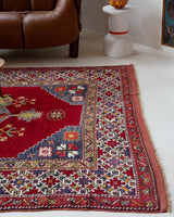Vintage Turkish rug in a living room setting, pile rug, Turkish rug, vintage rug, portland, rug shop, bright colors, wild shaman, soft rug, bold color, Portland, Oregon, rug store, rug shop, local shop, antique rug