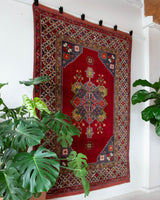 Vintage Turkish rug in a living room setting, pile rug, Turkish rug, vintage rug, portland, rug shop, bright colors, wild shaman, soft rug, bold color, Portland, Oregon, rug store, rug shop, local shop, antique rug