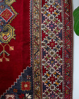 Vintage Turkish rug in a living room setting, pile rug, Turkish rug, vintage rug, portland, rug shop, bright colors, wild shaman, soft rug, bold color, Portland, Oregon, rug store, rug shop, local shop, antique rug