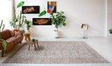 Area rug in a living room setting, pile rug, Turkish rug, old rug, antique rug, pastel colors, faded colors, Turkish rug, vintage rug, soft rug, Portland, Oregon, rug store, rug shop, local shop, distressed rug, worn out rug