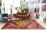 Vintage Turkish rug in a living room setting, pile rug, Turkish rug, vintage rug, portland, rug shop, bright colors, wild shaman, soft rug, bold color, Portland, Oregon, rug store, rug shop, local shop, antique rug