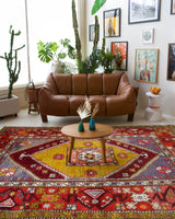 Vintage Turkish rug in a living room setting, pile rug, Turkish rug, vintage rug, portland, rug shop, bright colors, wild shaman, soft rug, bold color, Portland, Oregon, rug store, rug shop, local shop, antique rug