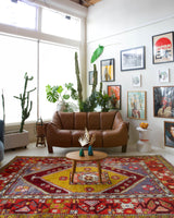 Vintage Turkish rug in a living room setting, pile rug, Turkish rug, vintage rug, portland, rug shop, bright colors, wild shaman, soft rug, bold color, Portland, Oregon, rug store, rug shop, local shop, antique rug