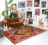Vintage Turkish rug in a living room setting, pile rug, Turkish rug, vintage rug, portland, rug shop, bright colors, wild shaman, soft rug, bold color, Portland, Oregon, rug store, rug shop, local shop, antique rug