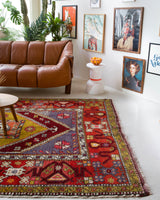 Vintage Turkish rug in a living room setting, pile rug, Turkish rug, vintage rug, portland, rug shop, bright colors, wild shaman, soft rug, bold color, Portland, Oregon, rug store, rug shop, local shop, antique rug