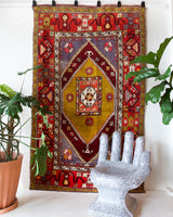 Vintage Turkish rug in a living room setting, pile rug, Turkish rug, vintage rug, portland, rug shop, bright colors, wild shaman, soft rug, bold color, Portland, Oregon, rug store, rug shop, local shop, antique rug