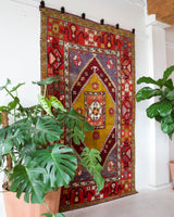 Vintage Turkish rug in a living room setting, pile rug, Turkish rug, vintage rug, portland, rug shop, bright colors, wild shaman, soft rug, bold color, Portland, Oregon, rug store, rug shop, local shop, antique rug