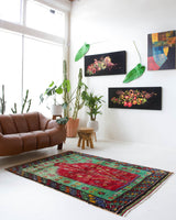 Vintage Turkish rug in a living room setting, pile rug, Turkish rug, vintage rug, portland, rug shop, bright colors, wild shaman, soft rug, bold color, Portland, Oregon, rug store, rug shop, local shop, antique rug