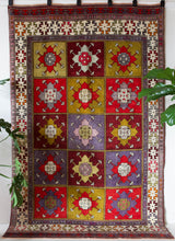 Vintage Turkish rug in a living room setting, pile rug, Turkish rug, vintage rug, portland, rug shop, bright colors, wild shaman, soft rug, bold color, Portland, Oregon, rug store, rug shop, local shop, antique rug