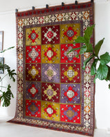 Vintage Turkish rug in a living room setting, pile rug, Turkish rug, vintage rug, portland, rug shop, bright colors, wild shaman, soft rug, bold color, Portland, Oregon, rug store, rug shop, local shop, antique rug