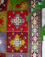 Vintage Turkish rug in a living room setting, pile rug, Turkish rug, vintage rug, portland, rug shop, bright colors, wild shaman, soft rug, bold color, Portland, Oregon, rug store, rug shop, local shop, antique rug