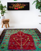 Vintage Turkish rug in a living room setting, pile rug, Turkish rug, vintage rug, portland, rug shop, bright colors, wild shaman, soft rug, bold color, Portland, Oregon, rug store, rug shop, local shop, antique rug