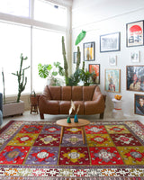 Vintage Turkish rug in a living room setting, pile rug, Turkish rug, vintage rug, portland, rug shop, bright colors, wild shaman, soft rug, bold color, Portland, Oregon, rug store, rug shop, local shop, antique rug