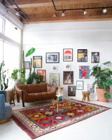 Vintage Turkish rug in a living room setting, pile rug, Turkish rug, vintage rug, portland, rug shop, bright colors, wild shaman, soft rug, bold color, Portland, Oregon, rug store, rug shop, local shop, antique rug