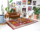 Vintage Turkish rug in a living room setting, pile rug, Turkish rug, vintage rug, portland, rug shop, bright colors, wild shaman, soft rug, bold color, Portland, Oregon, rug store, rug shop, local shop, antique rug