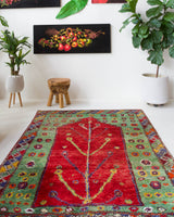 Vintage Turkish rug in a living room setting, pile rug, Turkish rug, vintage rug, portland, rug shop, bright colors, wild shaman, soft rug, bold color, Portland, Oregon, rug store, rug shop, local shop, antique rug
