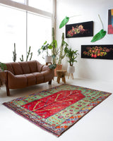 Vintage Turkish rug in a living room setting, pile rug, Turkish rug, vintage rug, portland, rug shop, bright colors, wild shaman, soft rug, bold color, Portland, Oregon, rug store, rug shop, local shop, antique rug