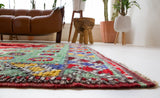 Vintage Turkish rug in a living room setting, pile rug, Turkish rug, vintage rug, portland, rug shop, bright colors, wild shaman, soft rug, bold color, Portland, Oregon, rug store, rug shop, local shop, antique rug