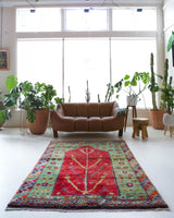 Vintage Turkish rug in a living room setting, pile rug, Turkish rug, vintage rug, portland, rug shop, bright colors, wild shaman, soft rug, bold color, Portland, Oregon, rug store, rug shop, local shop, antique rug