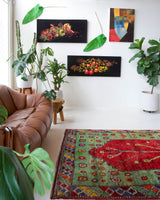 Vintage Turkish rug in a living room setting, pile rug, Turkish rug, vintage rug, portland, rug shop, bright colors, wild shaman, soft rug, bold color, Portland, Oregon, rug store, rug shop, local shop, antique rug