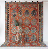 Vintage kilim rug in room decor setting, old rug, antique rug, pastel colors, faded colors, Turkish rug, vintage rug, soft rug, Portland, Oregon, rug store, rug shop, local shop, bold colors, bright colors, faded colors