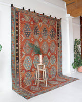 Vintage kilim rug in room decor setting, old rug, antique rug, pastel colors, faded colors, Turkish rug, vintage rug, soft rug, Portland, Oregon, rug store, rug shop, local shop, bold colors, bright colors, faded colors