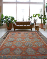 Vintage kilim rug in room decor setting, old rug, antique rug, pastel colors, faded colors, Turkish rug, vintage rug, soft rug, Portland, Oregon, rug store, rug shop, local shop, bold colors, bright colors, faded colors