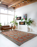 Vintage kilim rug in room decor setting, old rug, antique rug, pastel colors, faded colors, Turkish rug, vintage rug, soft rug, Portland, Oregon, rug store, rug shop, local shop, bold colors, bright colors, faded colors