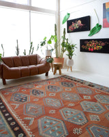 Vintage kilim rug in room decor setting, old rug, antique rug, pastel colors, faded colors, Turkish rug, vintage rug, soft rug, Portland, Oregon, rug store, rug shop, local shop, bold colors, bright colors, faded colors