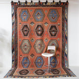Vintage kilim rug in room decor setting, old rug, antique rug, pastel colors, faded colors, Turkish rug, vintage rug, soft rug, Portland, Oregon, rug store, rug shop, local shop, bold colors, bright colors, faded colors