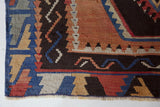 Vintage kilim rug in room decor setting, old rug, antique rug, pastel colors, faded colors, Turkish rug, vintage rug, soft rug, Portland, Oregon, rug store, rug shop, local shop, bold colors, bright colors, faded colors