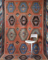 Vintage kilim rug in room decor setting, old rug, antique rug, pastel colors, faded colors, Turkish rug, vintage rug, soft rug, Portland, Oregon, rug store, rug shop, local shop, bold colors, bright colors, faded colors