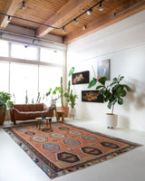 Vintage kilim rug in room decor setting, old rug, antique rug, pastel colors, faded colors, Turkish rug, vintage rug, soft rug, Portland, Oregon, rug store, rug shop, local shop, bold colors, bright colors, faded colors
