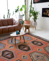 Vintage kilim rug in room decor setting, old rug, antique rug, pastel colors, faded colors, Turkish rug, vintage rug, soft rug, Portland, Oregon, rug store, rug shop, local shop, bold colors, bright colors, faded colors