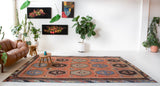 Vintage kilim rug in room decor setting, old rug, antique rug, pastel colors, faded colors, Turkish rug, vintage rug, soft rug, Portland, Oregon, rug store, rug shop, local shop, bold colors, bright colors, faded colors
