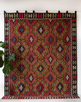 Vintage kilim rug in room decor setting, old rug, antique rug, pastel colors, faded colors, Turkish rug, vintage rug, soft rug, Portland, Oregon, rug store, rug shop, local shop, bold colors, bright colors, faded colors