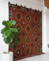 Vintage kilim rug in room decor setting, old rug, antique rug, pastel colors, faded colors, Turkish rug, vintage rug, soft rug, Portland, Oregon, rug store, rug shop, local shop, bold colors, bright colors, faded colors