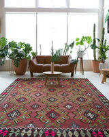 Vintage kilim rug in room decor setting, old rug, antique rug, pastel colors, faded colors, Turkish rug, vintage rug, soft rug, Portland, Oregon, rug store, rug shop, local shop, bold colors, bright colors, faded colors