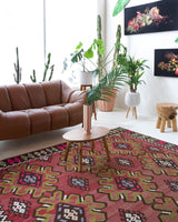 Vintage kilim rug in room decor setting, old rug, antique rug, pastel colors, faded colors, Turkish rug, vintage rug, soft rug, Portland, Oregon, rug store, rug shop, local shop, bold colors, bright colors, faded colors