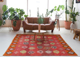 Vintage kilim rug in living room setting, bright colors, wild shaman, soft rug, bold color, Portland, Oregon, rug store, rug shop, local shop, vintage rug, modern kilim, warm colors