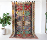 Vintage kilim rug in room decor setting, old rug, antique rug, pastel colors, faded colors, Turkish rug, vintage rug, soft rug, Portland, Oregon, rug store, rug shop, local shop, bold colors, bright colors, faded colors