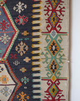 Vintage kilim rug in room decor setting, old rug, antique rug, pastel colors, faded colors, Turkish rug, vintage rug, soft rug, Portland, Oregon, rug store, rug shop, local shop, bold colors, bright colors, faded colors
