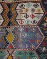 Vintage kilim rug in room decor setting, old rug, antique rug, pastel colors, faded colors, Turkish rug, vintage rug, soft rug, Portland, Oregon, rug store, rug shop, local shop, bold colors, bright colors, faded colors