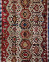 Vintage kilim rug in living room setting, old rug, antique rug, pastel colors, faded colors, Turkish rug, vintage rug, soft rug, Portland, Oregon, rug store, rug shop, local shop, earthy tones, earthy colors, warm colors