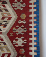 Vintage kilim rug in living room setting, old rug, antique rug, pastel colors, faded colors, Turkish rug, vintage rug, soft rug, Portland, Oregon, rug store, rug shop, local shop, earthy tones, earthy colors, warm colors