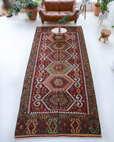 Vintage kilim rug in living room setting, bright colors, wild shaman, soft rug, bold color, Portland, Oregon, rug store, rug shop, local shop, vintage rug, modern kilim, warm colors