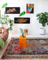 Vintage kilim rug in room decor setting, old rug, antique rug, pastel colors, faded colors, Turkish rug, vintage rug, soft rug, Portland, Oregon, rug store, rug shop, local shop, bold colors, bright colors, faded colors